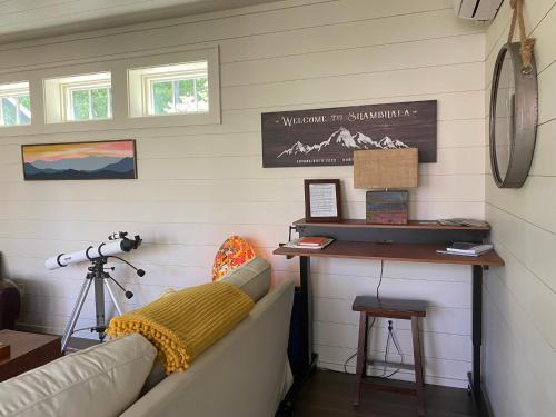 a living room with a couch and a table at Incredible Mountain Views with Private Hot Tub! in Highlands