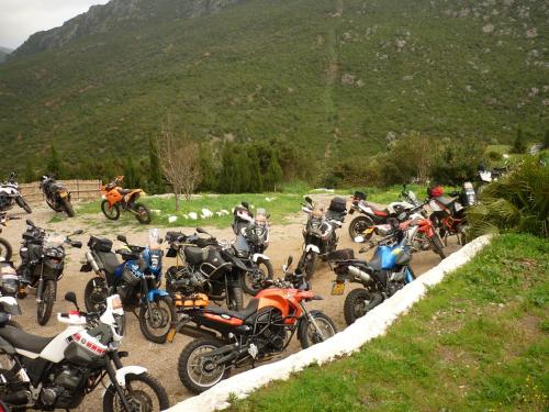 a group of motorcycles parked on a dirt road at Caiat Lounge Refuge in Taghzoute