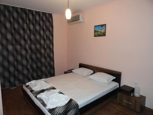 Postel nebo postele na pokoji v ubytování Cantilena Complex