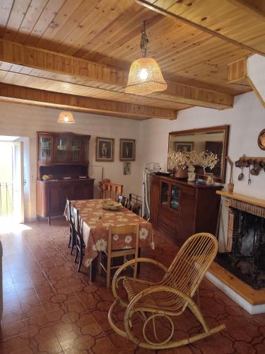 a dining room with a table and a fireplace at Tra cielo e terra in Trevi nel Lazio