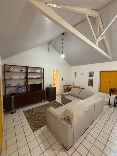 a large living room with a bed and a couch at Loft Cerejeira no Sítio Gaia Miguel Pereira RJ in Miguel Pereira
