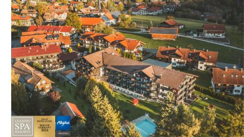 an aerial view of a building with a resort at Alpin & Wellness Resort Ludwig Royal in Oberstaufen