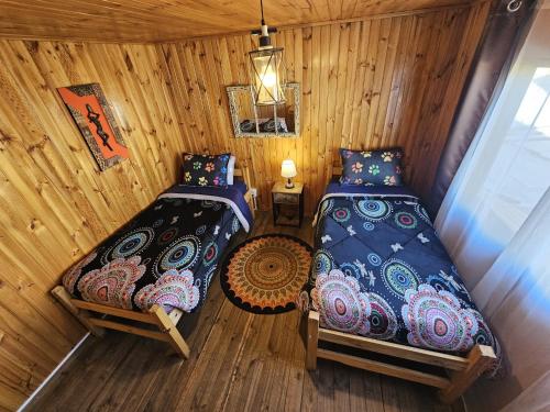 an overhead view of a bedroom with two beds at Hostal Sol y Luna in Santiago