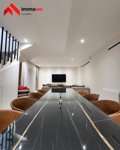 a conference room with a long table and chairs at Villa Prestige N116 in Arbatache