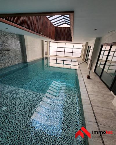 a swimming pool with a red x in the middle at Villa Prestige N116 in Arbatache