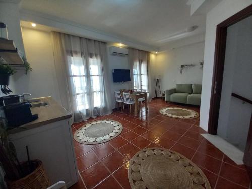 a living room with a couch and a table at Seaside Athos I in Ouranoupoli