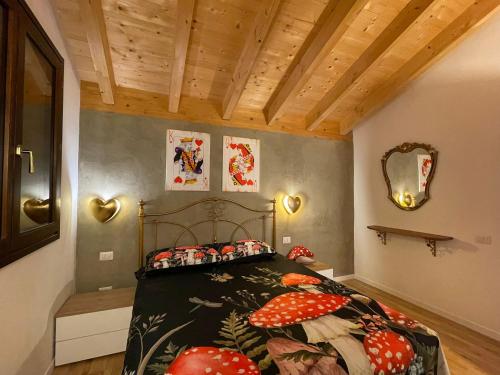 a bedroom with a bed and a wooden ceiling at La casa di Alice - Casa Natura in Senigallia