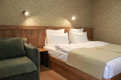 Ένα ή περισσότερα κρεβάτια σε δωμάτιο στο Hotel 717 Kazbegi