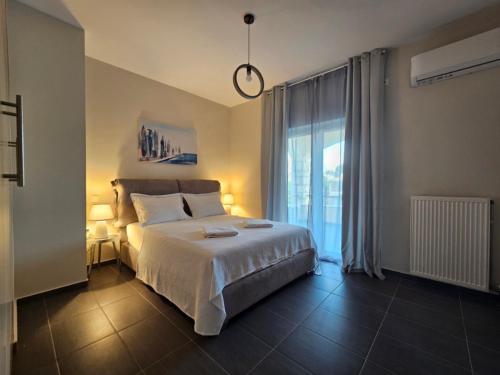 Ένα ή περισσότερα κρεβάτια σε δωμάτιο στο Viggas Relaxation Nafpaktos