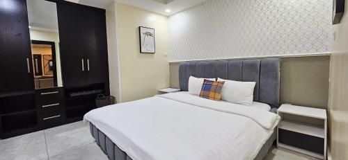 Letto o letti in una camera di The Leneade - City Centre at Wuse 2