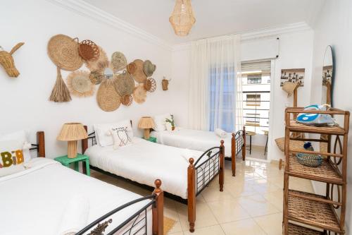 En eller flere senge i et værelse på Appartement 2 chambres près de la corniche