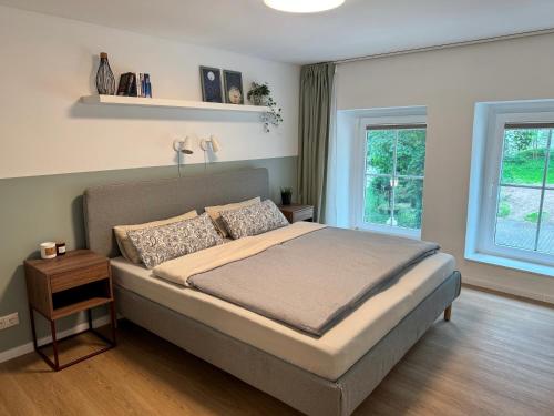 Postel nebo postele na pokoji v ubytování JUPAS - Premium Apartments Trier