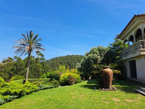 a house with a large vase in the yard at LUXURY CELAVELLA GALICIA Hc in Baiona