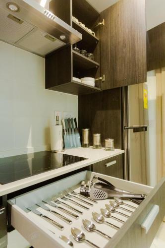 a kitchen with a bunch of knives on a counter at Accra Luxury Apartments @ The Lennox in Accra