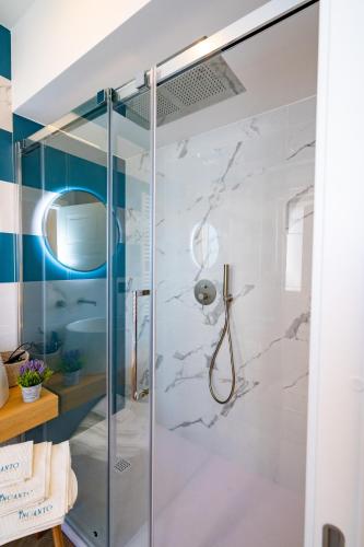 a bathroom with a shower with a glass door at Incanto in Cosenza