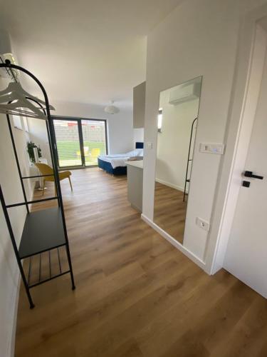 a room with two bunk beds and a bedroom at Green alpine nest Komenda in Komenda