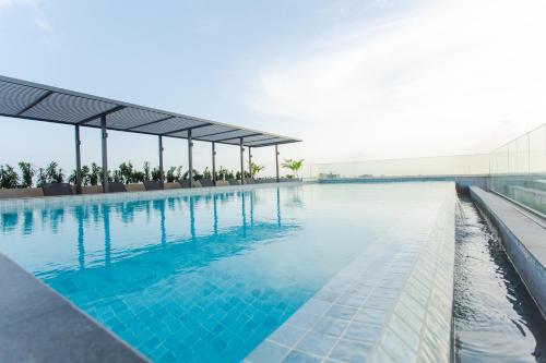 a swimming pool on the roof of a building at Accra Luxury Apartments @ The Lennox in Accra