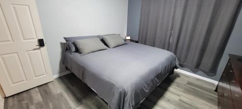 a bed with two pillows in a small room at Luxury 2 Bed 1 Bath Fully Private in Chula Vista