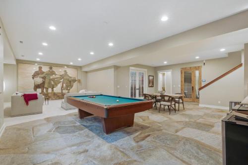 a living room with a pool table in it at Two bedroom condo with steam sauna and billiards in Boulder