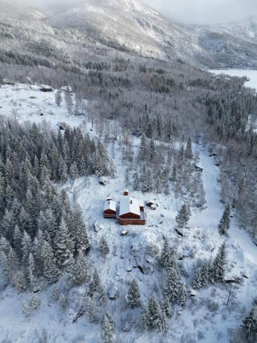 an aerial view of a cabin in the snow at Maxi Cabin with Sauna and Jacuzzi in Kovan