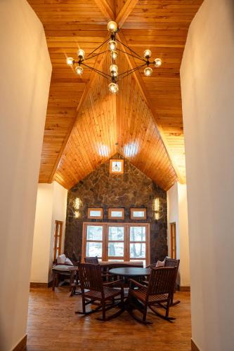 a dining room with a table and chairs at Celine Resorts Kumrat Valley in Tāl