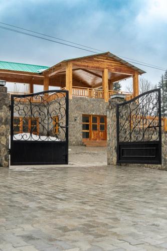 an entrance to a building with two gates at Celine Resorts Kumrat Valley in Tāl