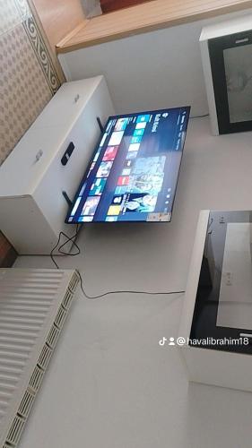 a laptop computer sitting on a desk next to a printer at Haval in Idar-Oberstein