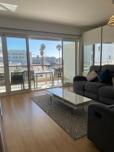 a living room with a couch and a table at 7 Degrees South in Lagos