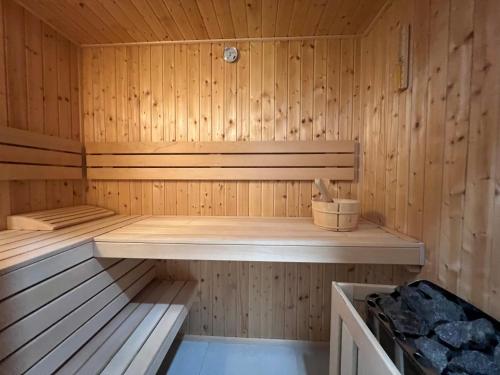 a wooden sauna with a bench in it at Sauna y in Cluj-Napoca