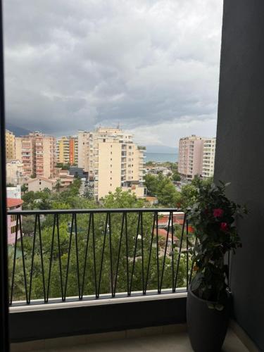 a balcony with a view of a city at South Inn Hotel in Vlorë