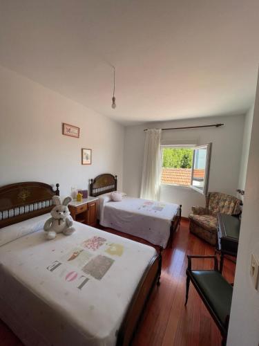 Postel nebo postele na pokoji v ubytování Apartamento céntrico Playa de Carnota