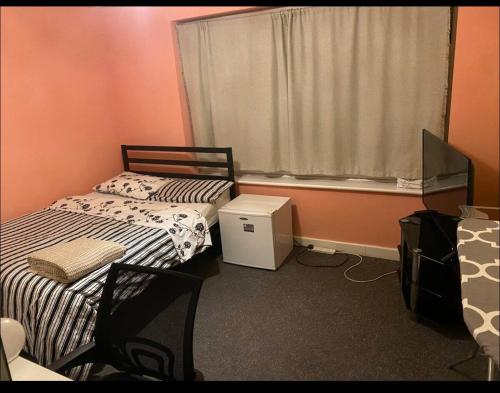 a bedroom with two twin beds and a window at Coven in Moffat