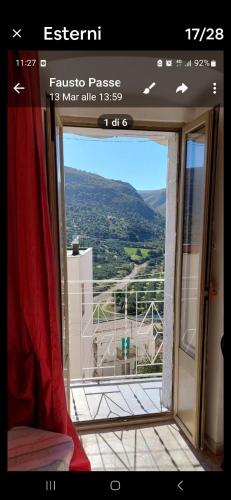 a room with a window with a view of a mountain at Casetta nel gargano in Cagnano Varano
