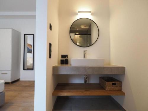 a bathroom with a sink and a mirror at Leni Top 1 in Dienten am Hochkönig