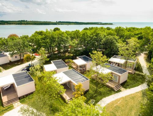 an aerial view of a house with solar panels on it at Mobile Homes - FKK Nudist Camping Solaris in Poreč