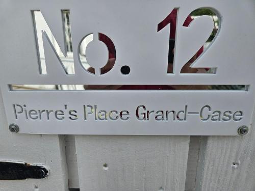 a sign for a fireplace place grand case at Pierre's Place Grand-Case, a place to dream in Grand Case