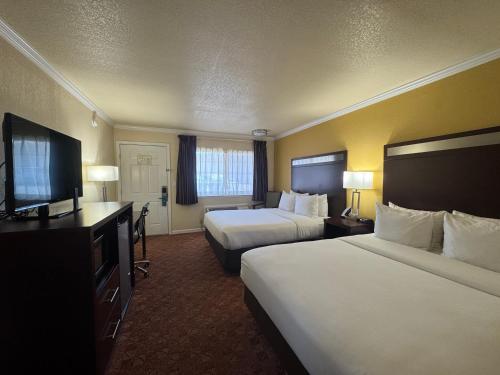Ένα ή περισσότερα κρεβάτια σε δωμάτιο στο Quality Inn Ukiah