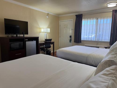 Ένα ή περισσότερα κρεβάτια σε δωμάτιο στο Quality Inn Ukiah