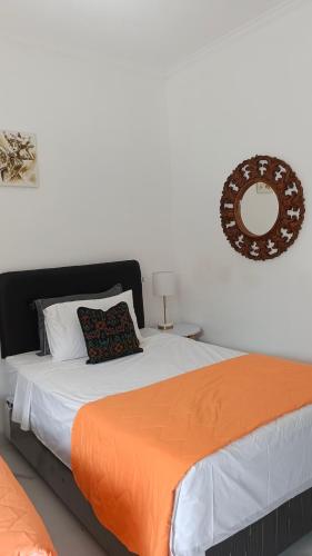 Ένα ή περισσότερα κρεβάτια σε δωμάτιο στο Aroha Villa