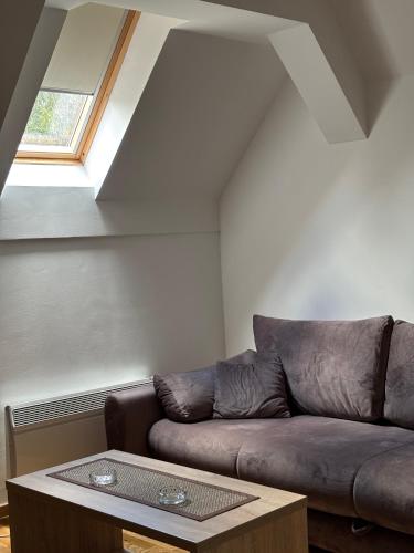 a living room with a couch and a table at Alexandro Apartmani Zlatibor in Zlatibor