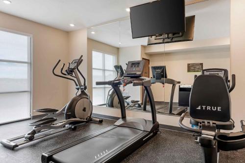a gym with three exercise bikes and a flat screen tv at Extended Stay America Premier Suites - Yuma in Yuma