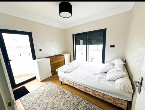 Ένα ή περισσότερα κρεβάτια σε δωμάτιο στο Luxe Appartement Centre Agadir