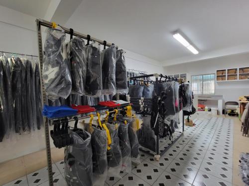 a room with a bunch of bags on display at Green Flash Dive Inn in Garapan