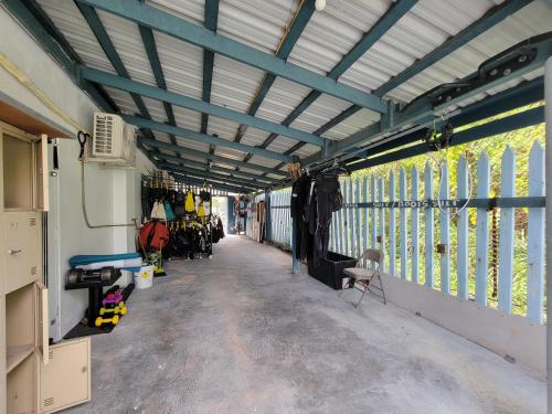 an inside view of a bus garage with awning at Green Flash Dive Inn in Garapan