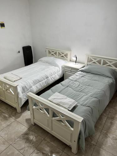 Posteľ alebo postele v izbe v ubytovaní Lodge Araucaria Apartamento por día