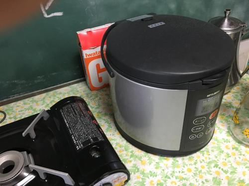 a toaster sitting on a counter next to a blender at Towadako Hostel in Towada