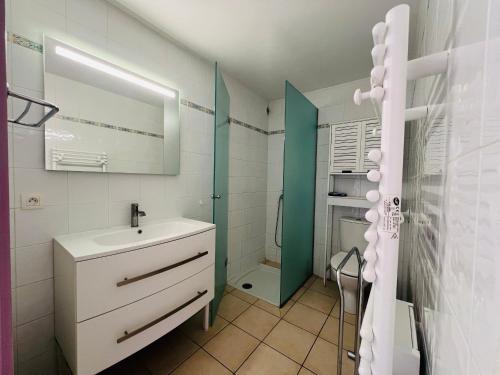 a white bathroom with a sink and a shower at Argelès-sur-Mer - T2 Cabine Meublé avec Clim et Terrasse à 50m de la Plage - FR-1-309-172 in Argelès-sur-Mer