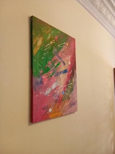 a painting hanging on a wall at logemois in Rabat