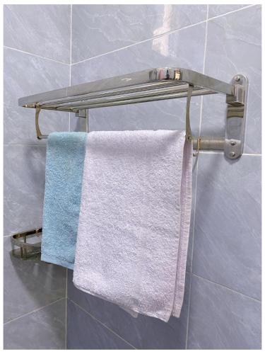 a towel rack in a bathroom with two towels at Alpha homes in Gatunga