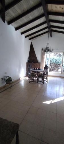 a dining room with a table and chairs in a room at Luz Azul Casa de Huéspedes in La Plata